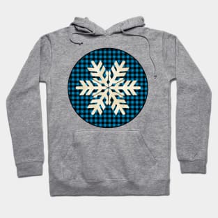 Snowflake silhouette over a black and blue tile pattern Hoodie